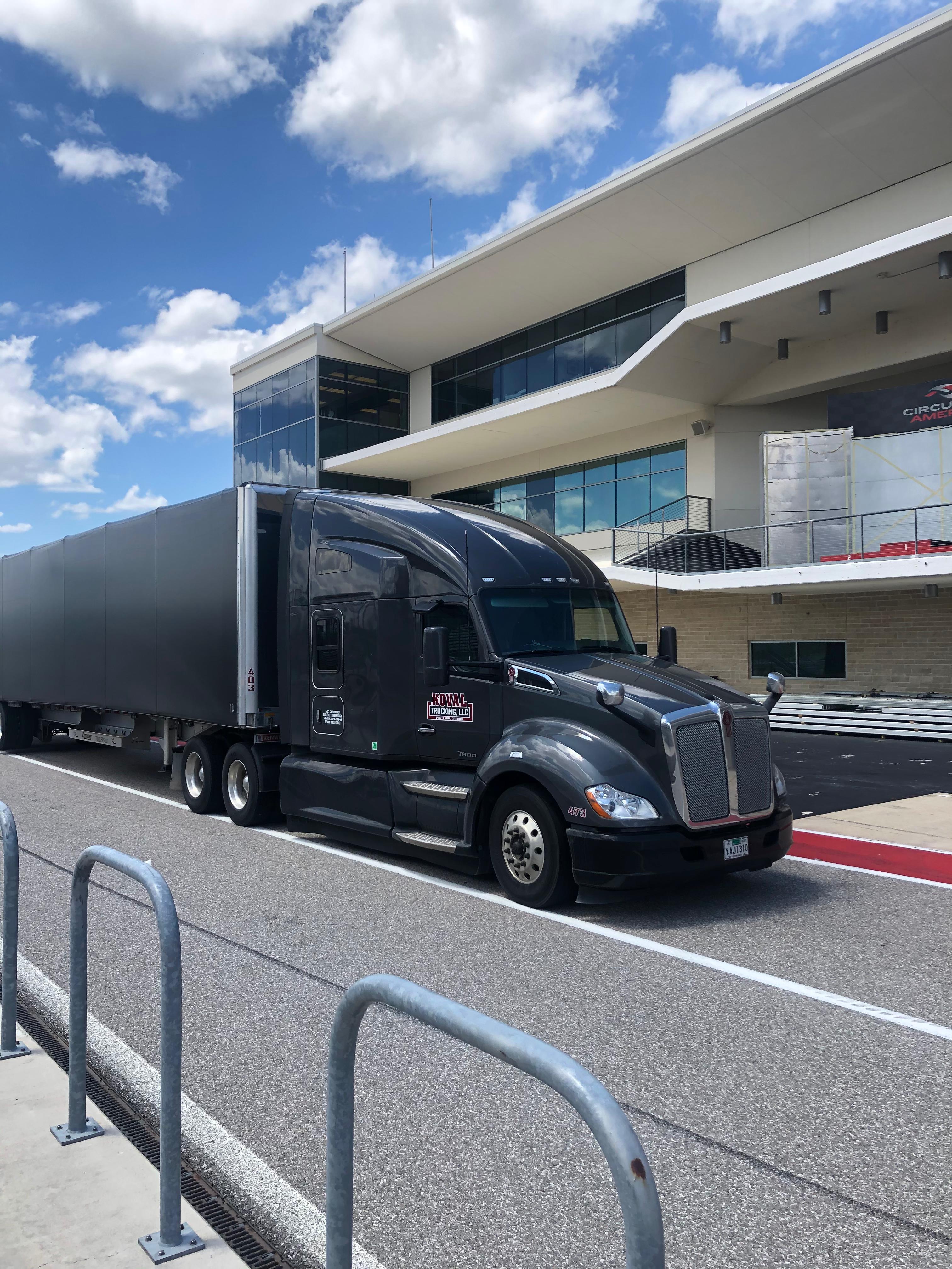 Koval Trucking black truck and trailer ready for West Coast freight